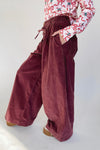 The Dorsey Corduroy Pin Tuck Wide Leg Pant in Burgundy