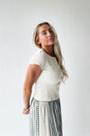 The Lyra Ribbed Button-Up Blouse in Ivory