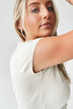 The Lyra Ribbed Button-Up Blouse in Ivory