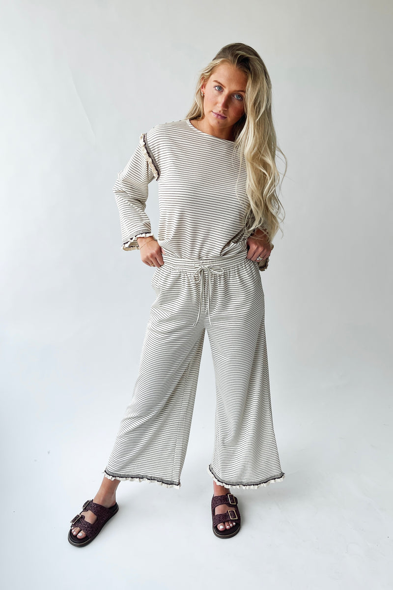 The Lyla Ruffle Edge Striped Pant in Cream + Brown