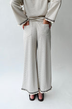The Lyla Ruffle Edge Striped Pant in Cream + Brown