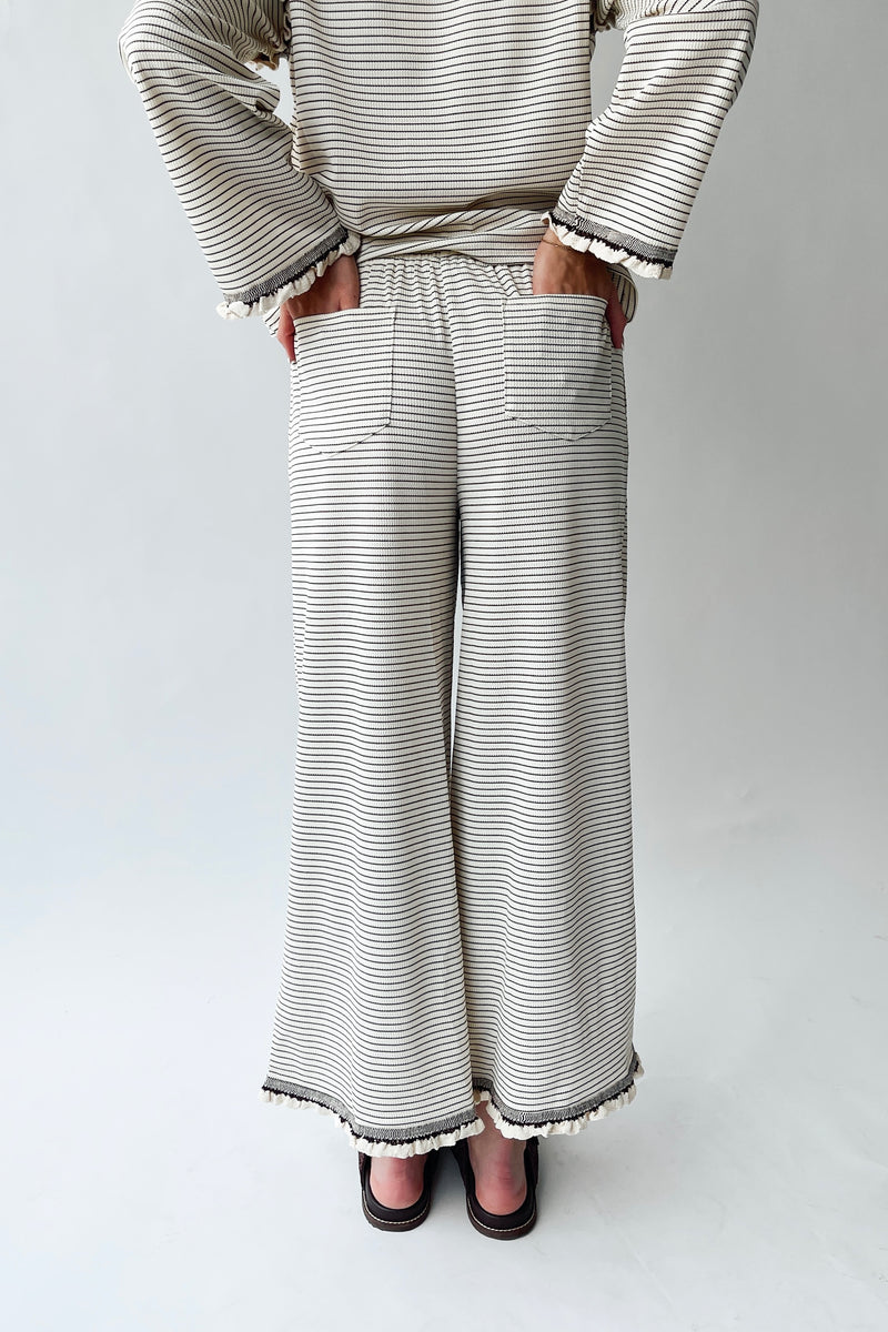 The Lyla Ruffle Edge Striped Pant in Cream + Brown
