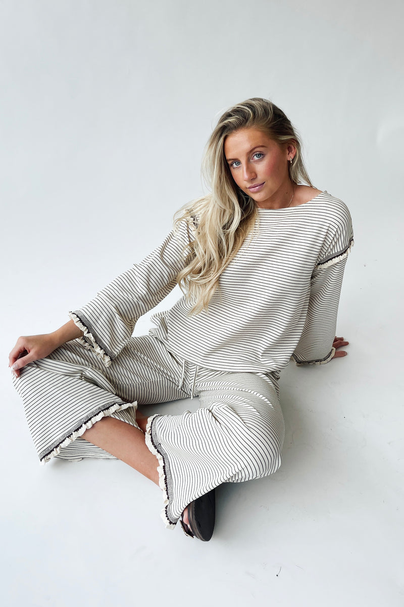 The Lyla Ruffle Edge Striped Pant in Cream + Brown