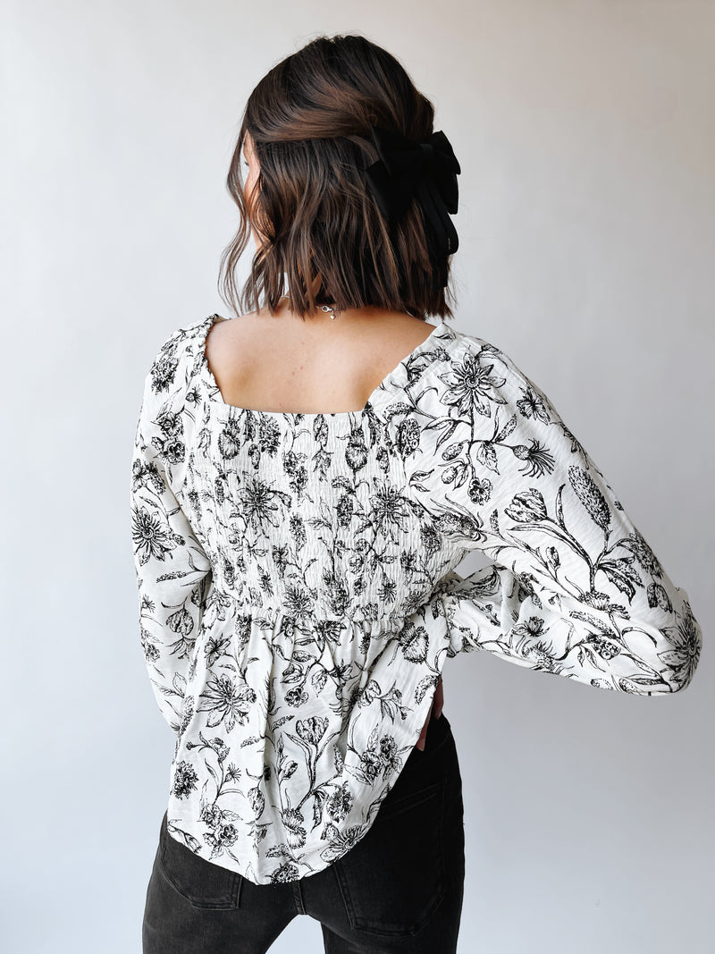 The Tola Tie Detail Blouse in Black Floral