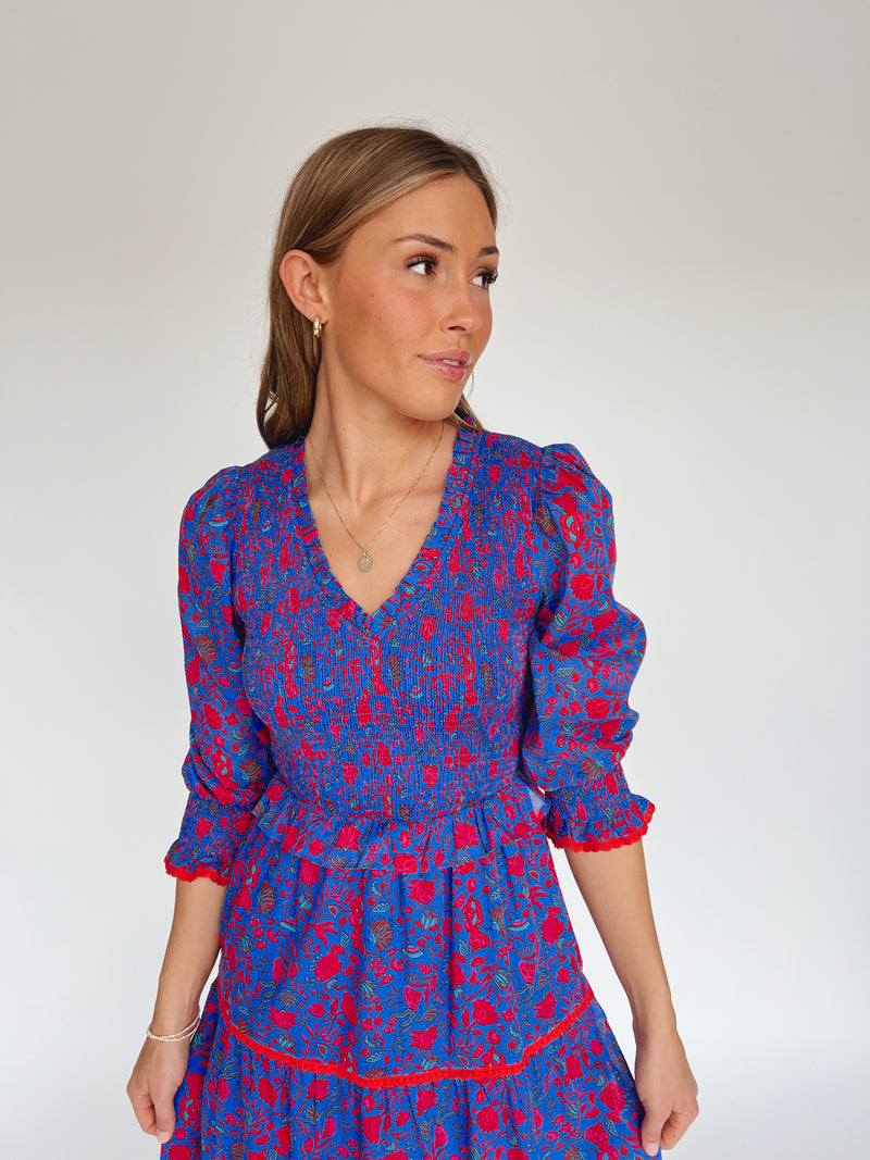 The Snook Smocked Floral Midi Dress in Blue + Fuchsia