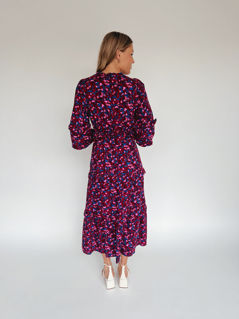 The Turma Tiered Maxi Dress in Burgundy + Pink