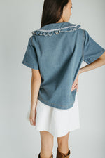 The Marasol Ruffle Collared Blouse in Denim