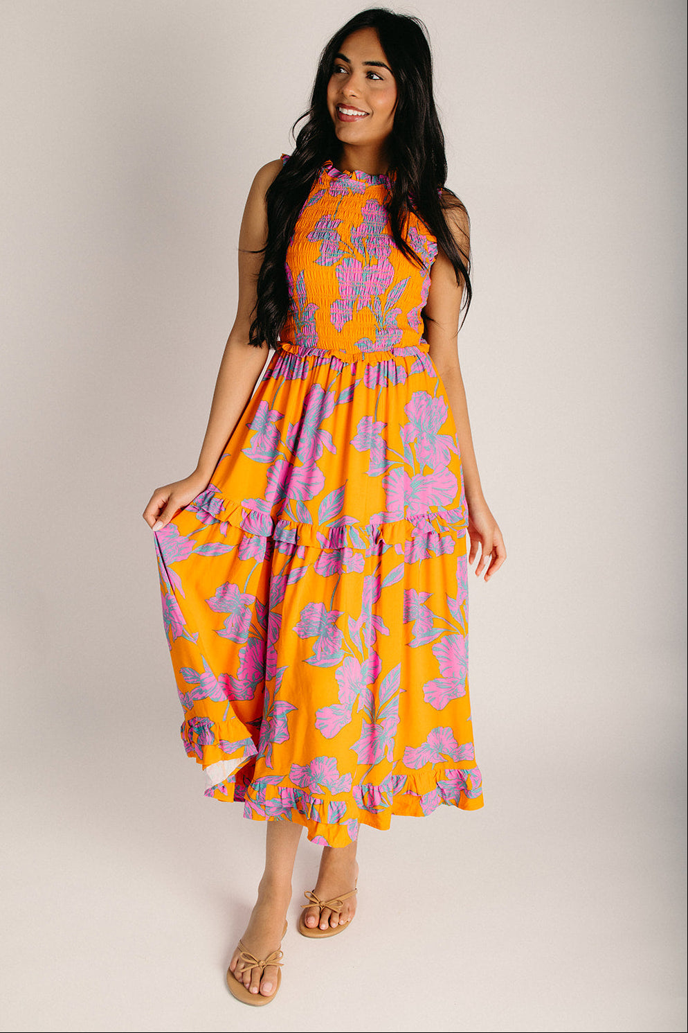 orange and purple dress The Kathia Smocked Floral Midi Dress in Orange + Pink Small