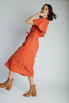 The Tessie Striped Linen Midi Dress in Orange