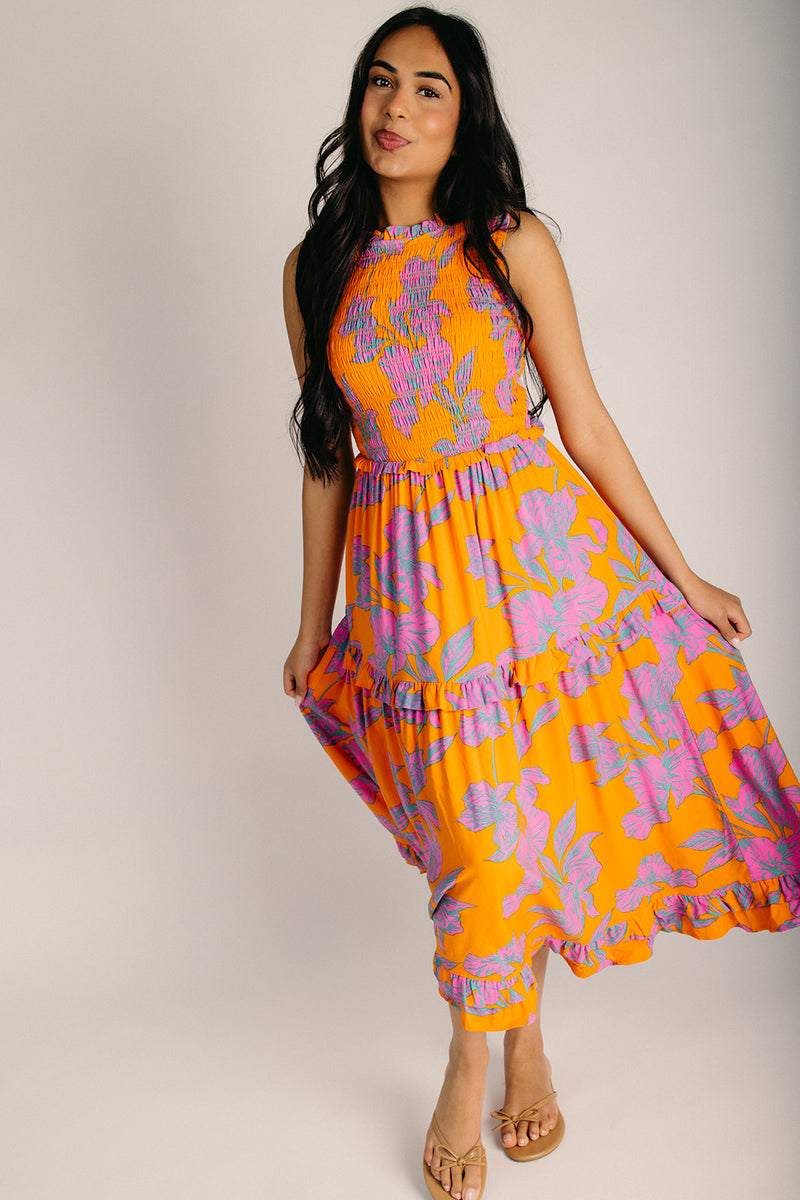 The Kathia Smocked Floral Midi Dress in Orange + Pink Piper & Scoot The Kathia Smocked Floral Midi Dress in Orange + Pink Piper & Scoot
