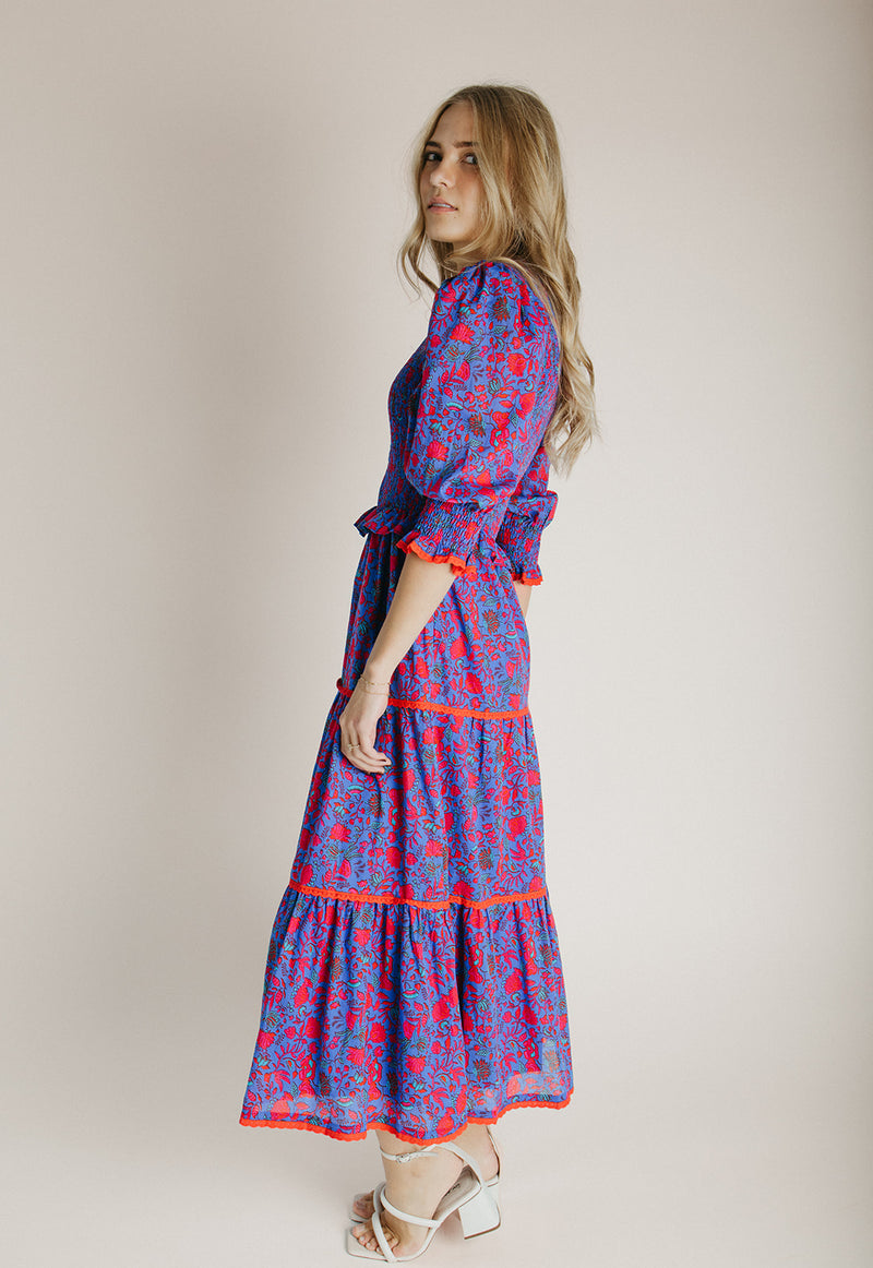 The Snook Smocked Floral Midi Dress in Blue + Fuchsia