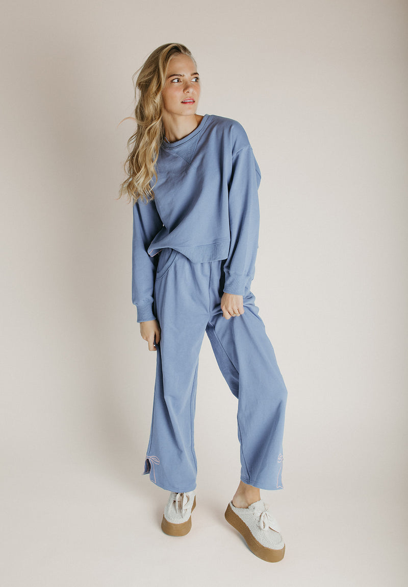 The Monzingo Bow Embroidered Pullover in Dusty Blue