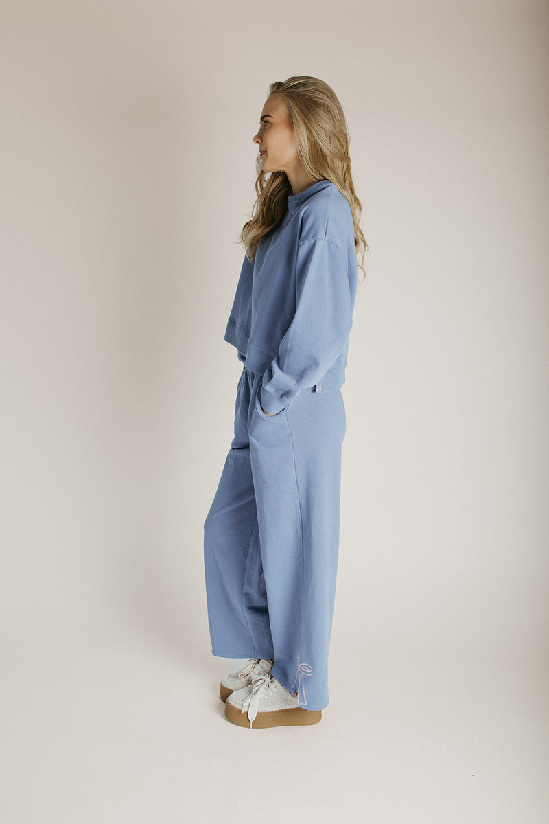 The Monzingo Bow Embroidered Pullover in Dusty Blue