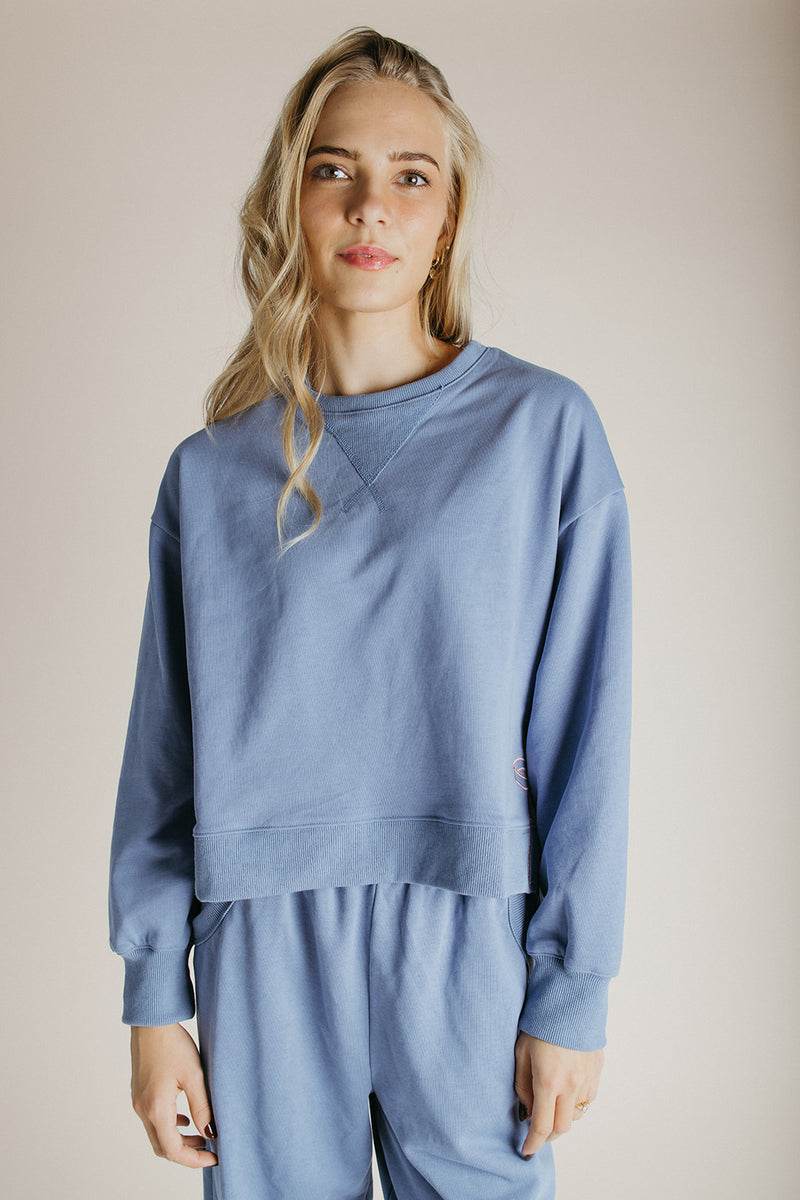 The Monzingo Bow Embroidered Pullover in Dusty Blue