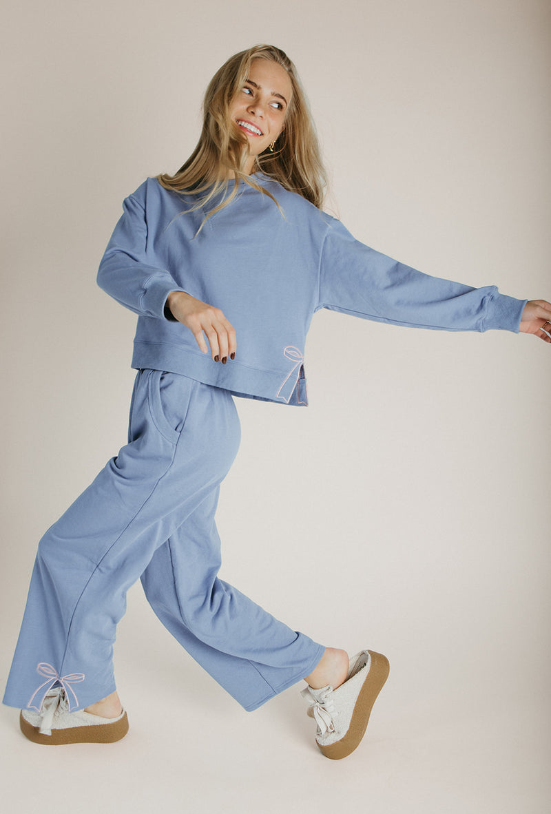The Monzingo Bow Embroidered Pullover in Dusty Blue