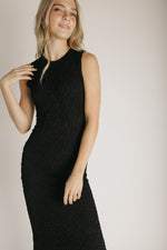 The Amberlyn Sleeveless Sweater Dress in Black