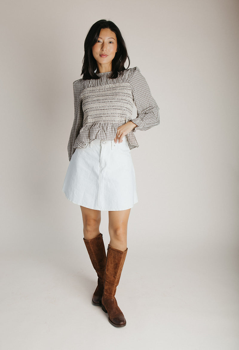 The Delgra Smocked Peplum Blouse in Cream + Brown