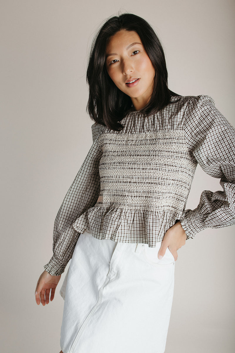 The Delgra Smocked Peplum Blouse in Cream + Brown