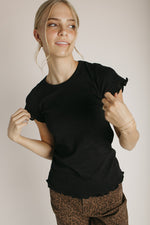 The Kyra Ruffle Hem Tee in Black