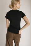 The Kyra Ruffle Hem Tee in Black