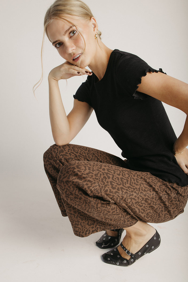 The Kyra Ruffle Hem Tee in Black
