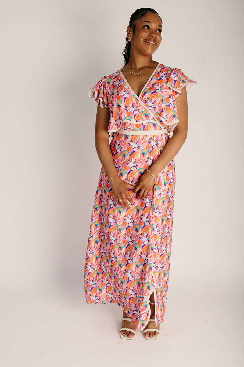 The Longoria Scalloped Hem Wrap Dress in Peach Floral Medium The Longoria Scalloped Hem Wrap Dress in Peach Floral Medium