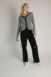 The Evangeline Lace Trim Cardigan in Ivory + Black