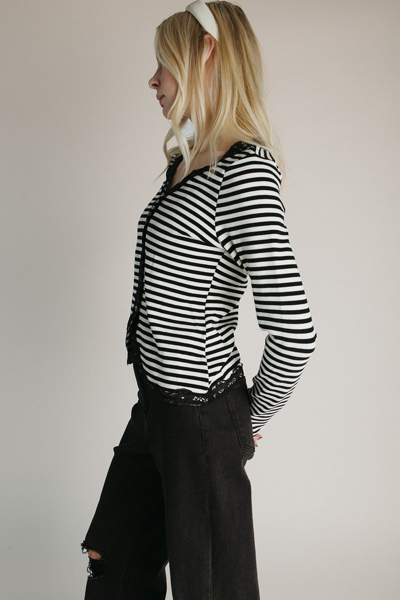 The Evangeline Lace Trim Cardigan in Ivory + Black