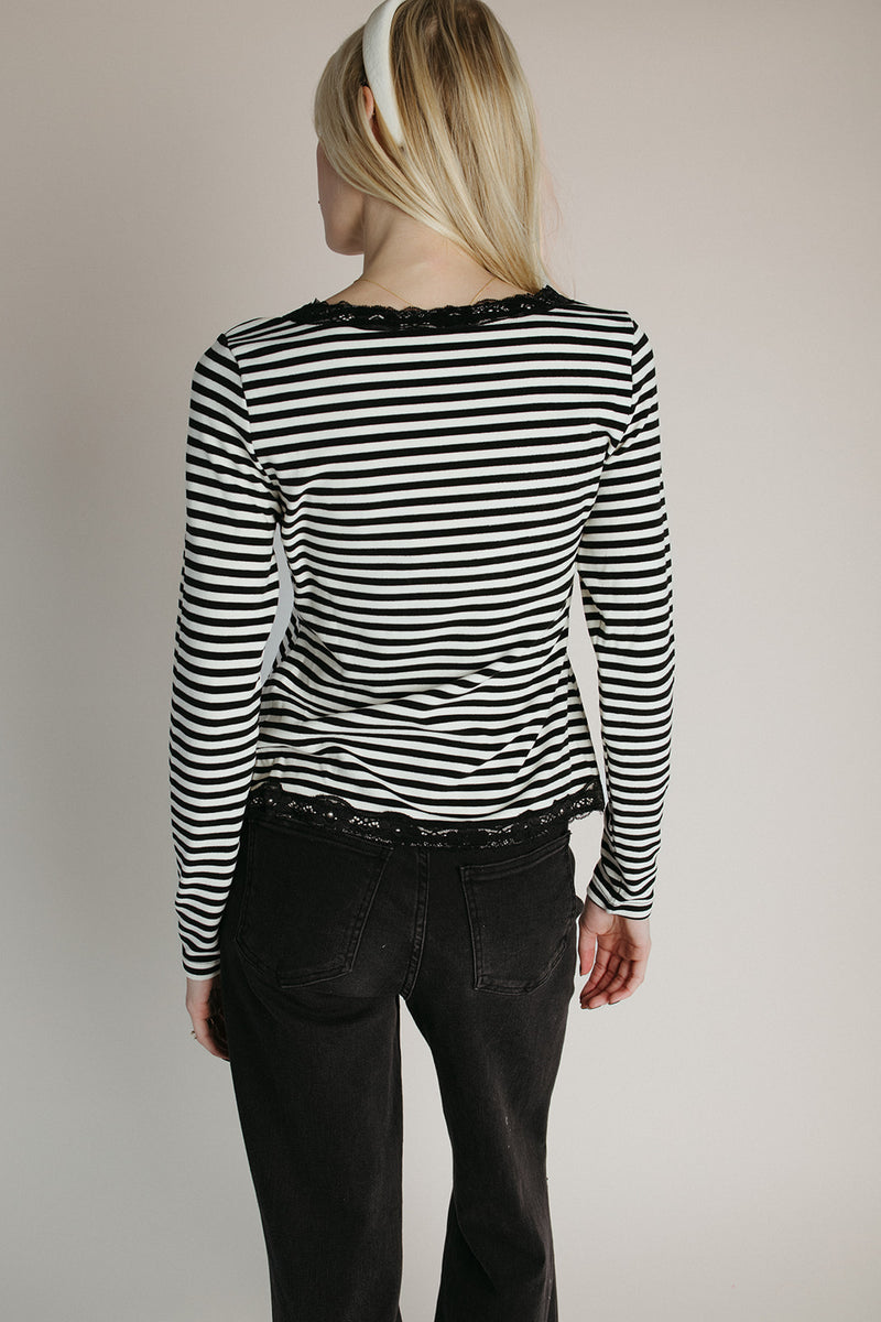 The Evangeline Lace Trim Cardigan in Ivory + Black