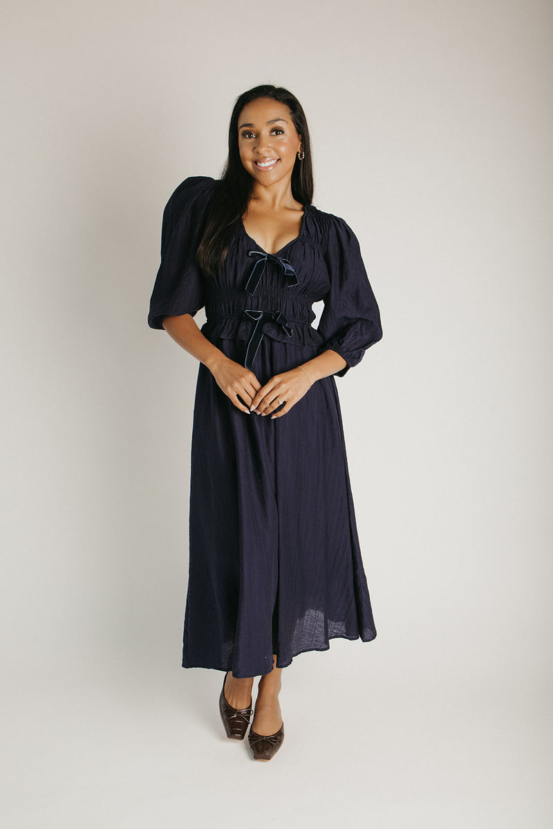The Travillo Velvet Bow Detail Midi Dress in Navy