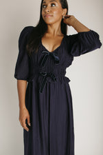 The Travillo Velvet Bow Detail Midi Dress in Navy