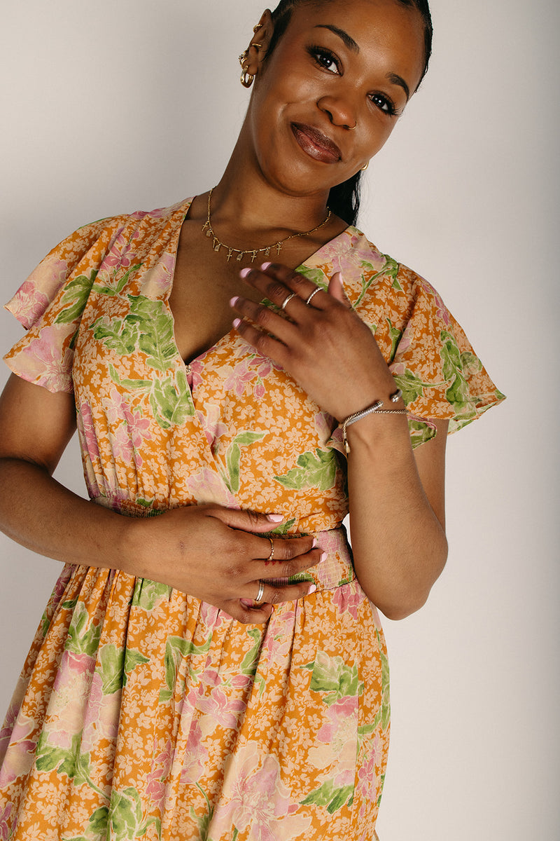 The Arnella Tiered Floral Maxi Dress in Tan Piper & Scoot The Arnella Tiered Floral Maxi Dress in Tan Piper & Scoot