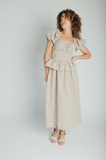 The Stacy Polka Dot Peplum Midi Dress in Taupe + Brown