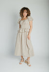 The Stacy Polka Dot Peplum Midi Dress in Taupe + Brown