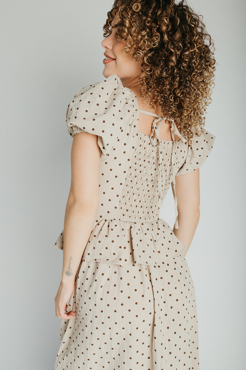 The Stacy Polka Dot Peplum Midi Dress in Taupe + Brown