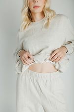 The Goldie Bubble Hem Pullover in Heathered Oat