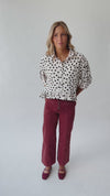 The Marla Polka Dot Peplum Blouse in Off White + Black