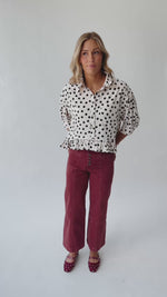 The Marla Polka Dot Peplum Blouse in Off White + Black