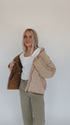 The Nukuri Quilted Corduroy Puffer Jacket in Dusty Mauve