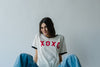 The XOXO Graphic Tee in Natural + Black