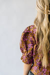 The Waimea Puff Sleeve Patterned Blouse in Brown, studio shoot; back view