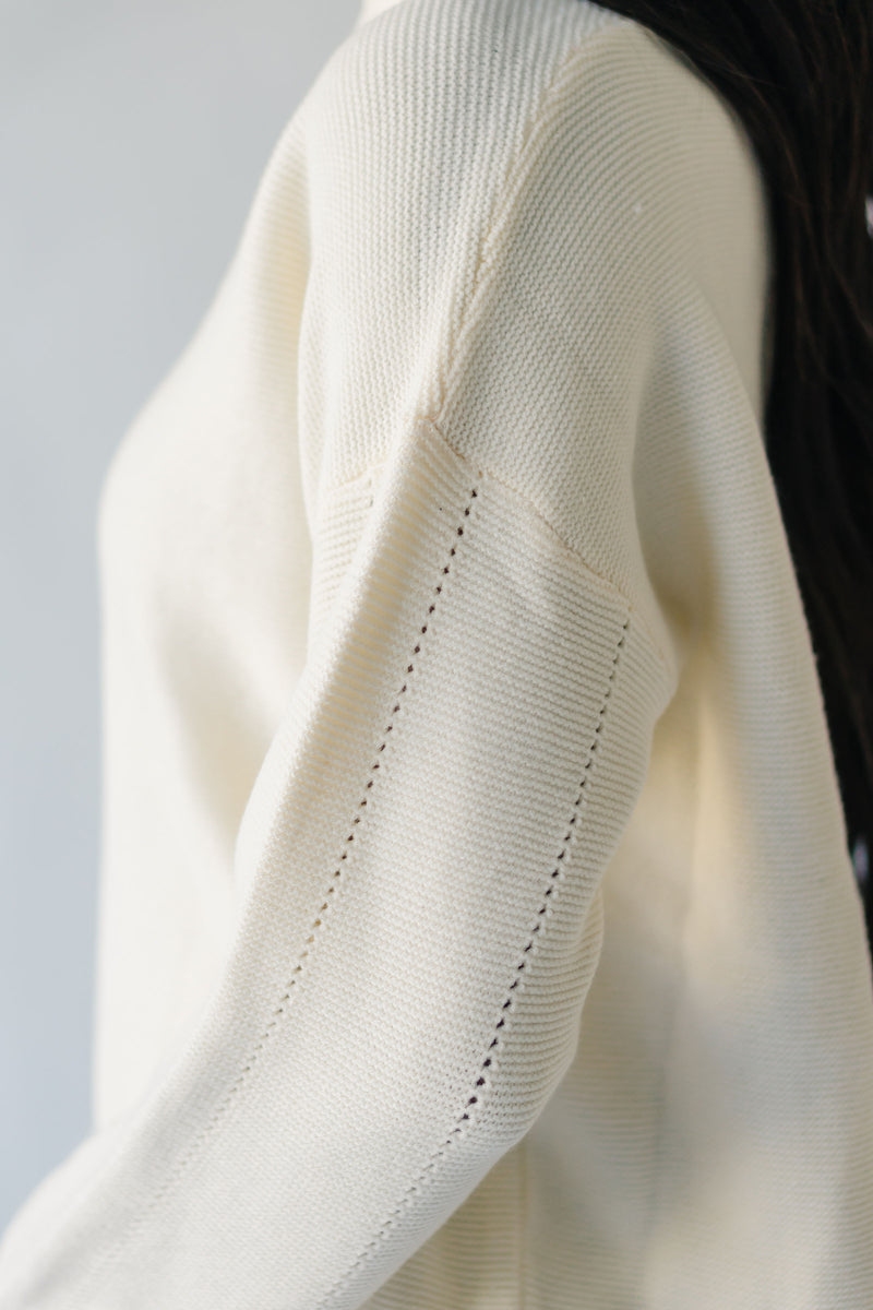 The Sonya V-Neck Ribbed Knit Sweater in Cream