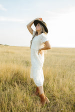 The Watts Textured Detail Dress in Cream, lifestyle shoot; side view