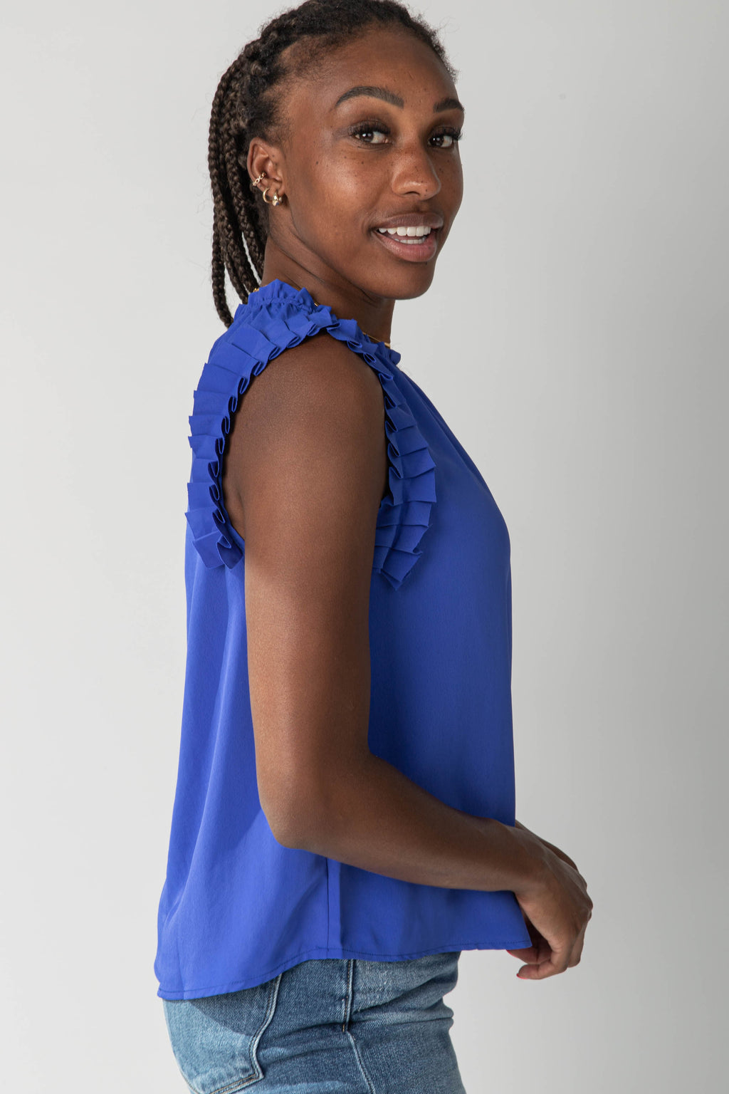 The Wilmer Ruffle Sleeve Top in Royal Blue, studio shoot; front view