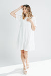 The Calloway Eyelet Detail Dress in White, studio shoot; front view