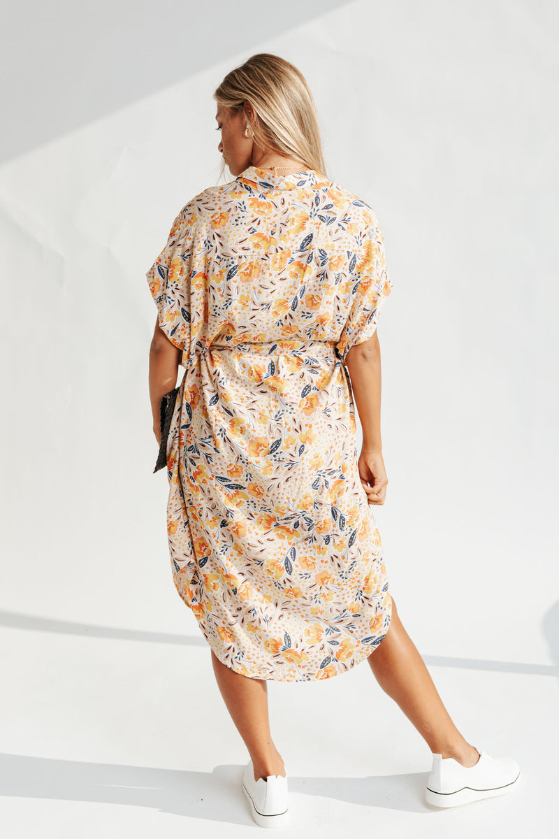 The Skylar Button Floral Dress in Blush, studio shoot; back view