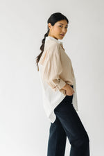 The Fritz Oversized Button-Up in White + Taupe, studio shoot; side view