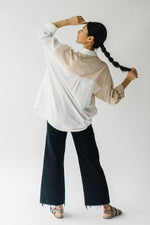 The Fritz Oversized Button-Up in White + Taupe, studio shoot; back view