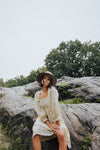 Piper & Scoot: The Adanna Floral Detail Dress in Cream, lifestyle shoot; front view