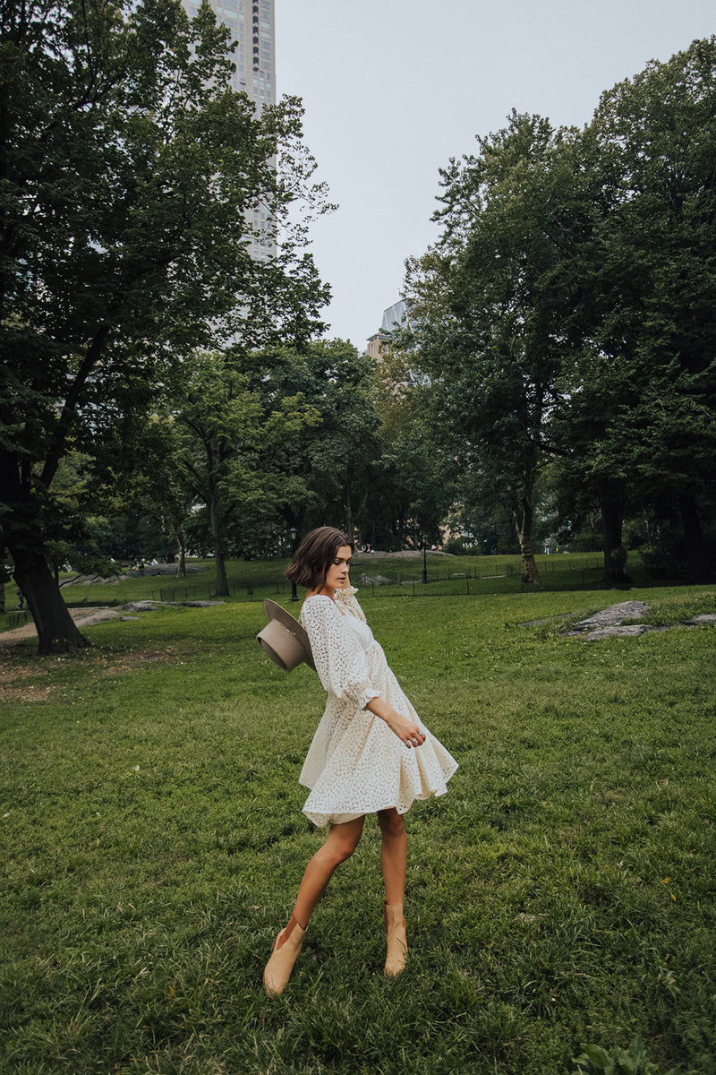 Piper & Scoot: The Adanna Floral Detail Dress in Cream, lifestyle shoot; front view